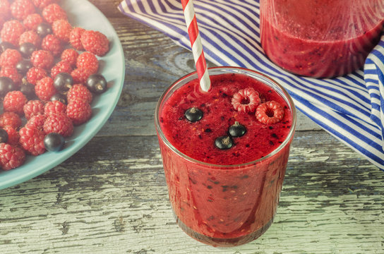 Berry smoothie. Smoothies with raspberries and black currants. Bright and healthy cocktail