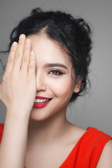 Fashion portrait of asian woman with elegant hairstyle. Perfect makeup.