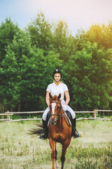 Girl jockey riding a horse