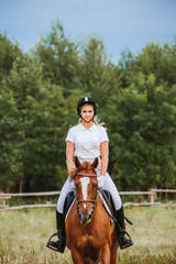 Girl jockey riding a horse