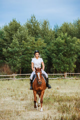 Girl jockey riding a horse