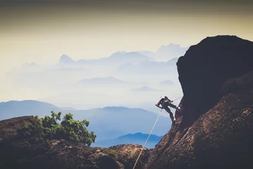 Muurstickers Climber against mountain valley. Instagram stylization © Bashkatov