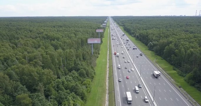 Aerial view on a wide highway with heavy traffic.