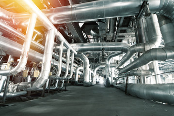 Equipment, cables and piping as found inside of a modern industrial power plant