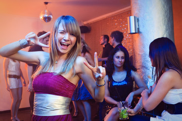 Pretty Blond Woman Dancing In A Nightclub