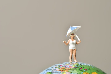 miniature old woman in swimsuit