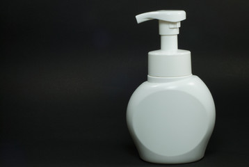 White cosmetic package with black background