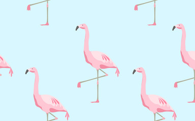 seamless pattern of flamingos over blue background