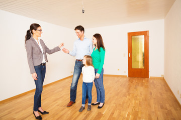 Fototapeta premium Realtor Giving Customers The Key To Their New Flat