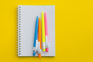 Notebook with colored pens