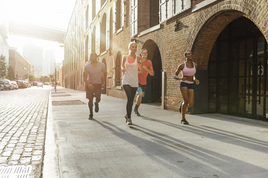 USA New York City Happy Friends running in Brooklyn