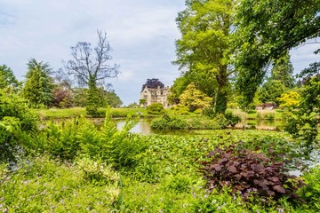 Colorful Britisch castle garden during spring in Suussex, England