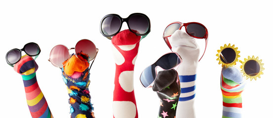 Sock puppets with glasses against white background - obrazy, fototapety, plakaty