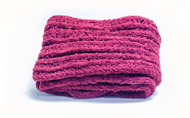 Selective focus of Warm knitted red scarf on white background