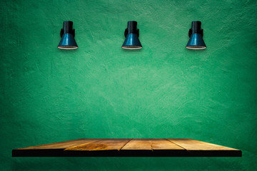 Old retro three lamp on green grunge concrete wall with wooden  shelves  ,Presentation backdrop