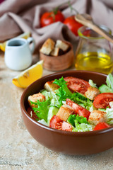 Vitamin salad with vegetables and lemon juice on a concrete background
