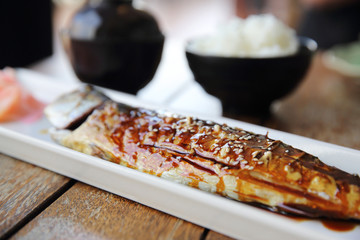 Grilled Mackerel fish with sauce , Saba yakitori on wood background , Japanese food