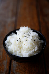 Rice on wood background
