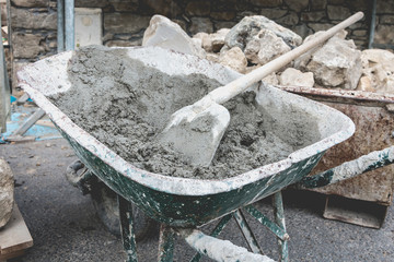 wheelbarrow filled with cement on a renovation project