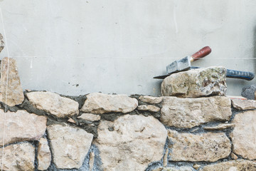 stone wall under construction on a renovation project