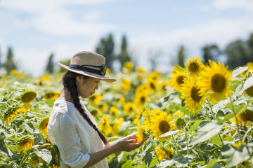 Sunflower field and beautiful women