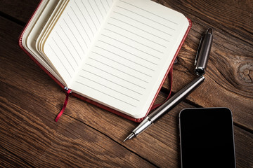 Blank notebook and ink pen.