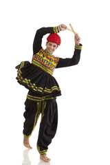Male dandiya dancer dancing with sticks 