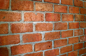 Terracotta brick wall in diminishing perspective view, for background and texture 