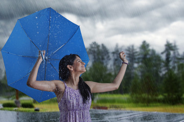 Woman having fun in the rain