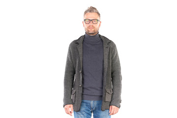 Studio portrait of middle aged man wearing casual clothing and eyeglasses