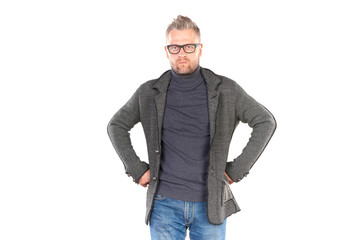 Studio portrait of middle aged man wearing casual clothing and eyeglasses