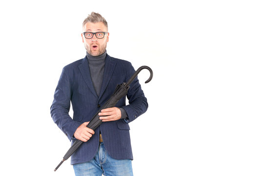 Elegant Middle-aged Businessman Holding Closed Stick Umbrella