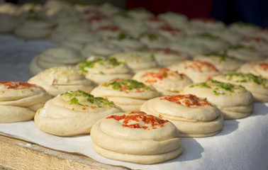 Bread on board before baking