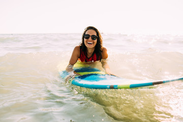 Young woman surfing 