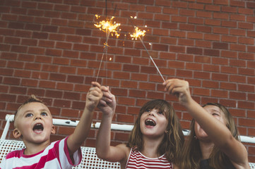 children and sparkler © karrastock