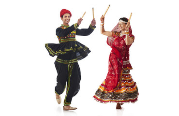 Couple performing dandia dance 