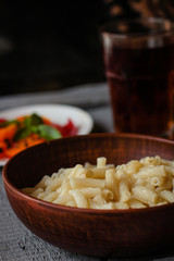 Pasta with butter in a glaze bowl