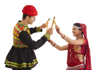 Couple with sticks dancing 