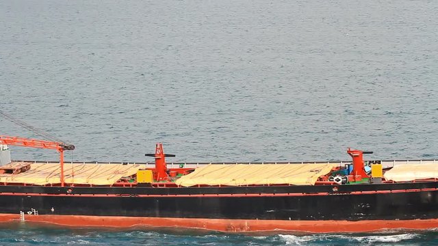 Close up of a super tanker ship with the deck crane, sailing in Bosporus waters in Istanbul. High Angle View, Static Shot. A 228 mt long, 32 meter width vessel, has a deadweight of 75,000 tons