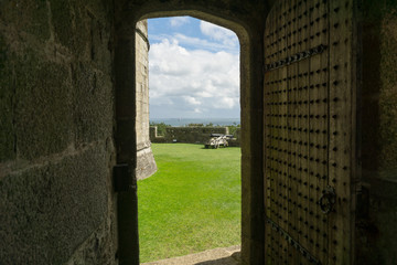 Looking through a doorway of a Castle to the outside