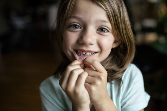 Portrait of smiling girl showing tooth gap
