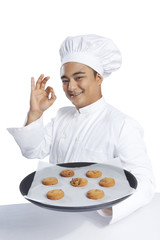 Portrait of chef giving ok hand gesture