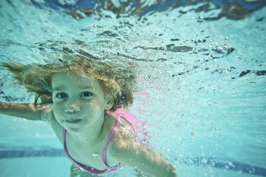 Portrait Of Girl Swimming Underwater