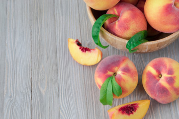 Peaches on wooden background with copy space