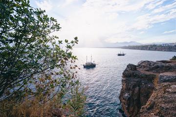 Beautiful landscape with sea bay, mountains and ship. Antalya, Turkey.