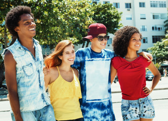 Group of latin and african american and caucasian man and woman walking in city