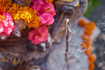 Traditional incense stick with flower decoration. © Loginova