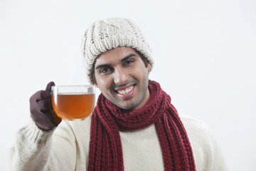 Man drinking black tea over white background 