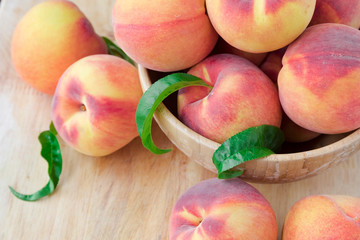 Peaches on wooden background