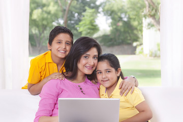 Portrait of family with laptop